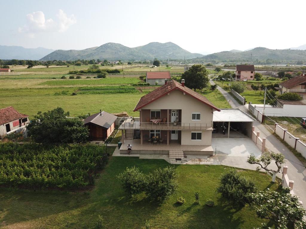 an aerial view of a house in a field at Eko Apartmani Krackovic in Podgorica