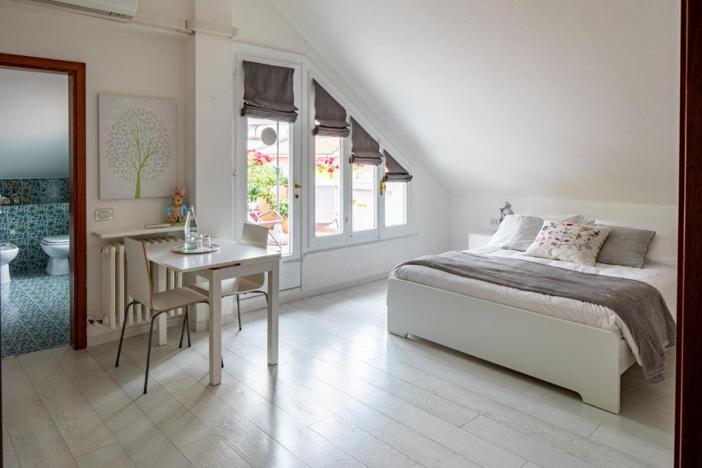 Łóżko lub łóżka w pokoju w obiekcie Casa di Anna