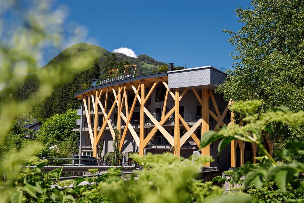 a building with a train on top of it at Hotel Ratschingserhof in Racines