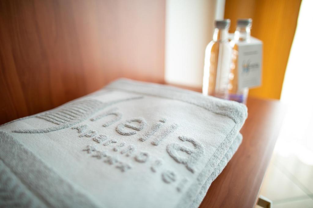 Postel nebo postele na pokoji v ubytování Hotel Sheila