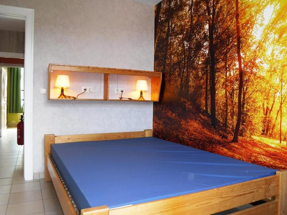 Postel nebo postele na pokoji v ubytování Les Gîtes d'Olloy - Le Roi Cerf