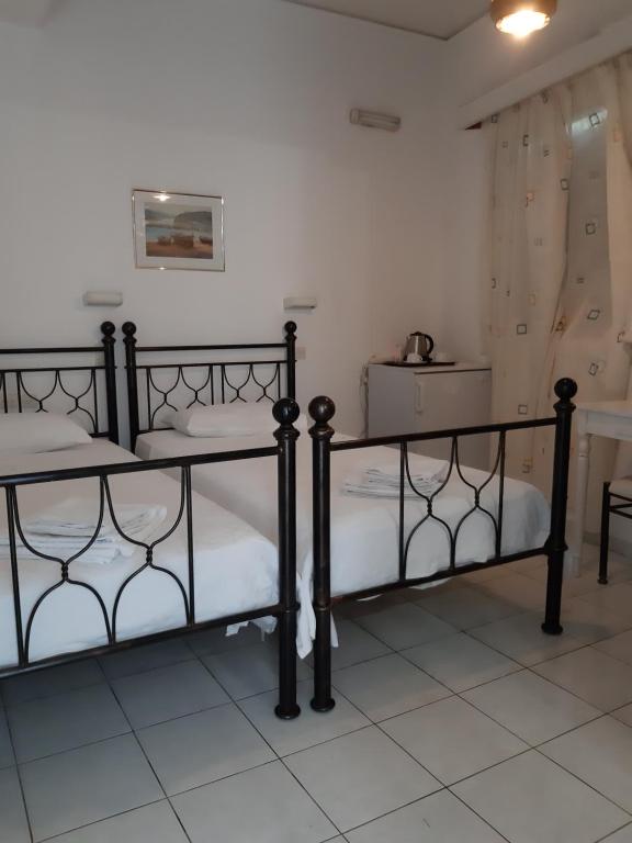 Postel nebo postele na pokoji v ubytování Pergola Hotel