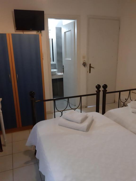 Postel nebo postele na pokoji v ubytování Pergola Hotel