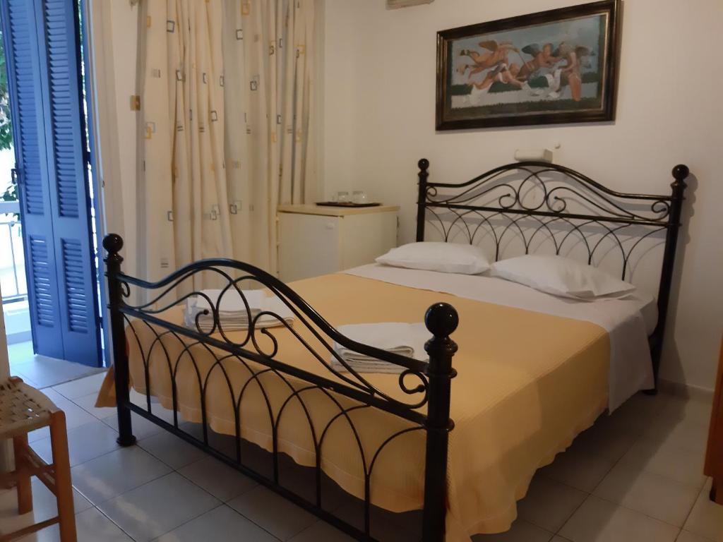Postel nebo postele na pokoji v ubytování Pergola Hotel