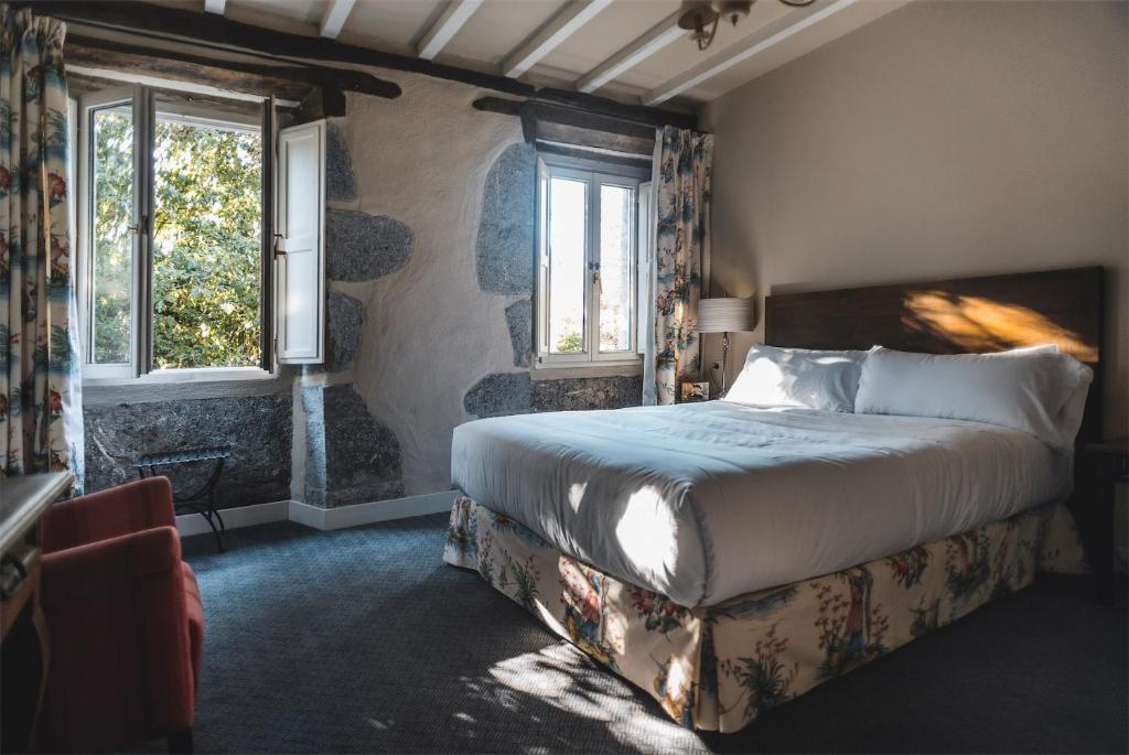Postel nebo postele na pokoji v ubytování Hotel Zubieta