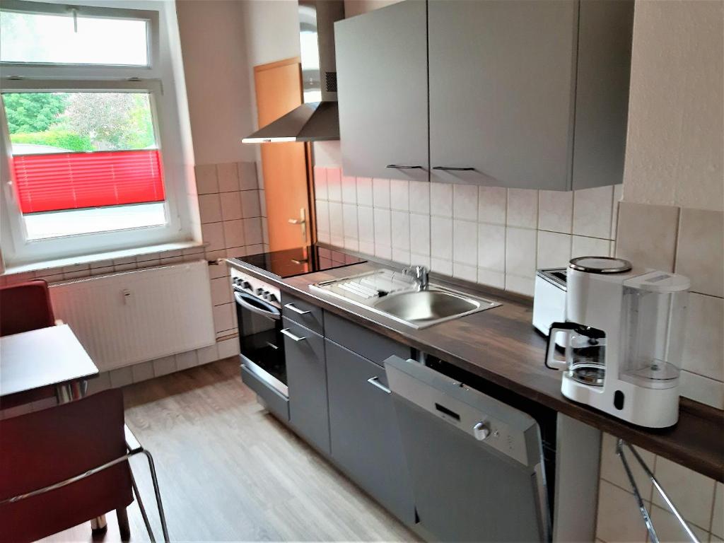 Kuchyň nebo kuchyňský kout v ubytování Hotel Fabrice