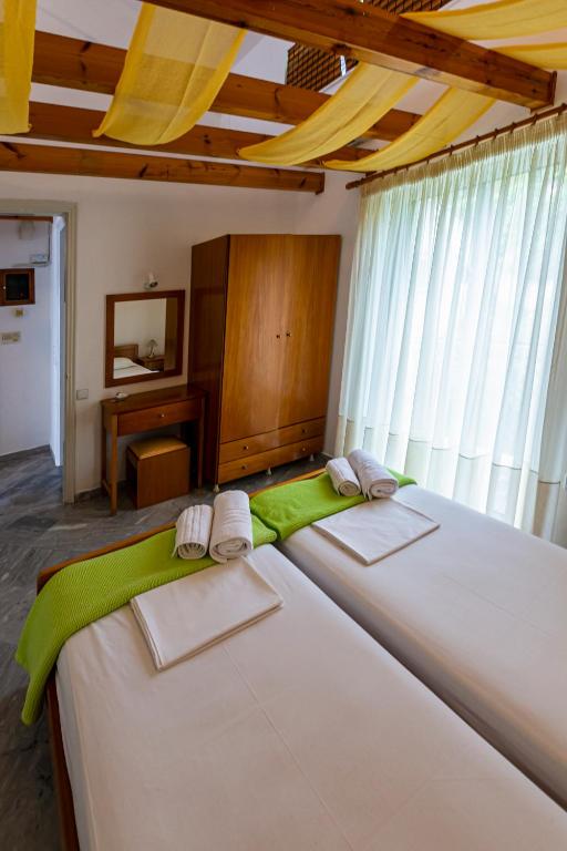 Posteľ alebo postele v izbe v ubytovaní Iris Apartments
