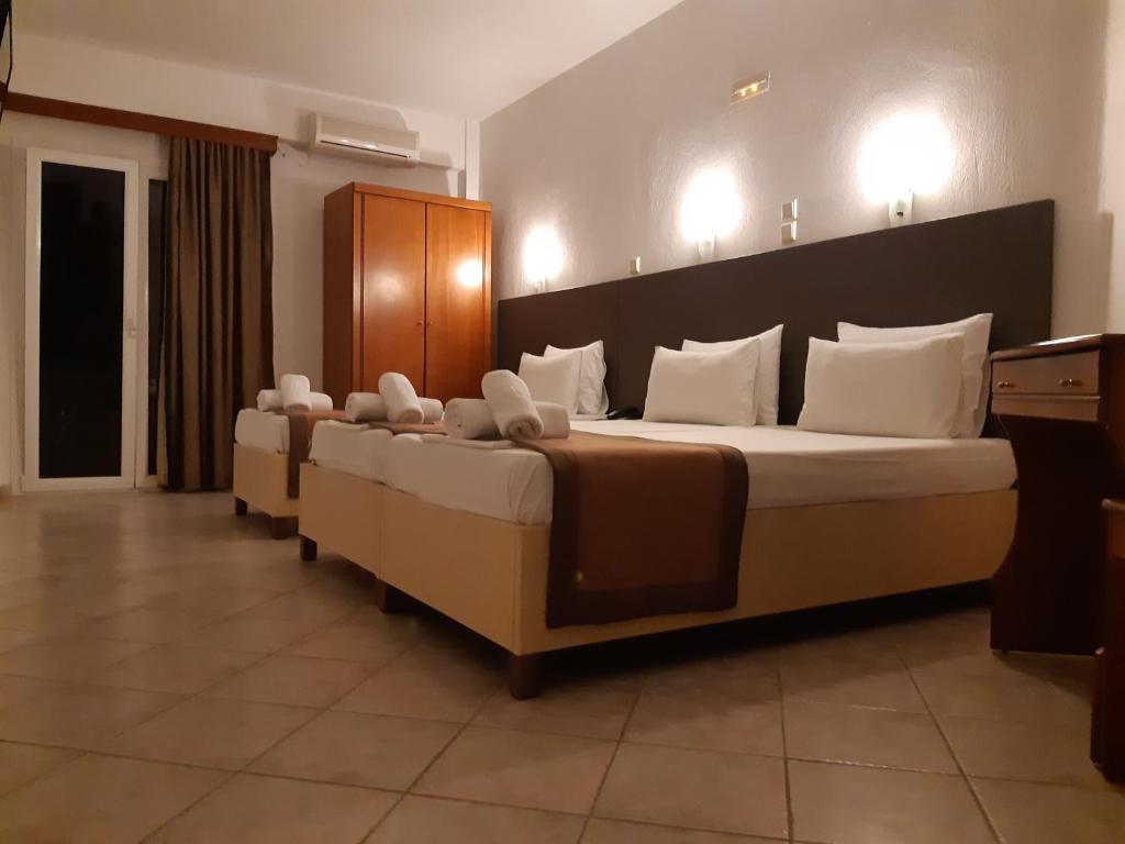 Posteľ alebo postele v izbe v ubytovaní Hotel Ilios