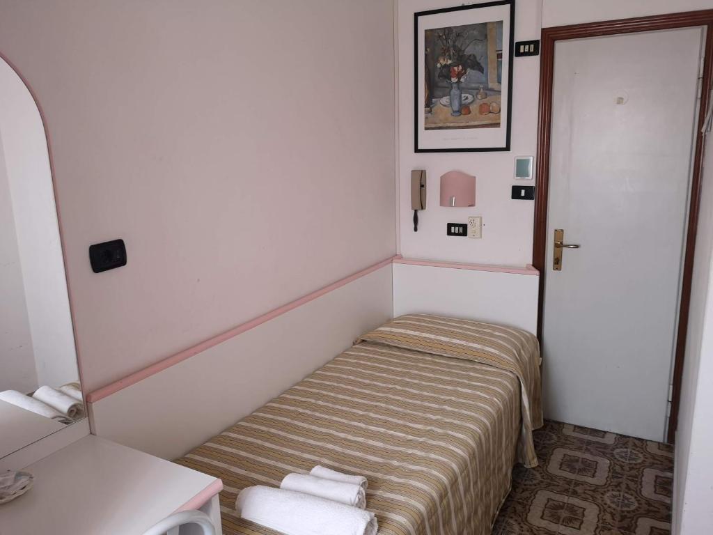 Postel nebo postele na pokoji v ubytování Hotel Rosy
