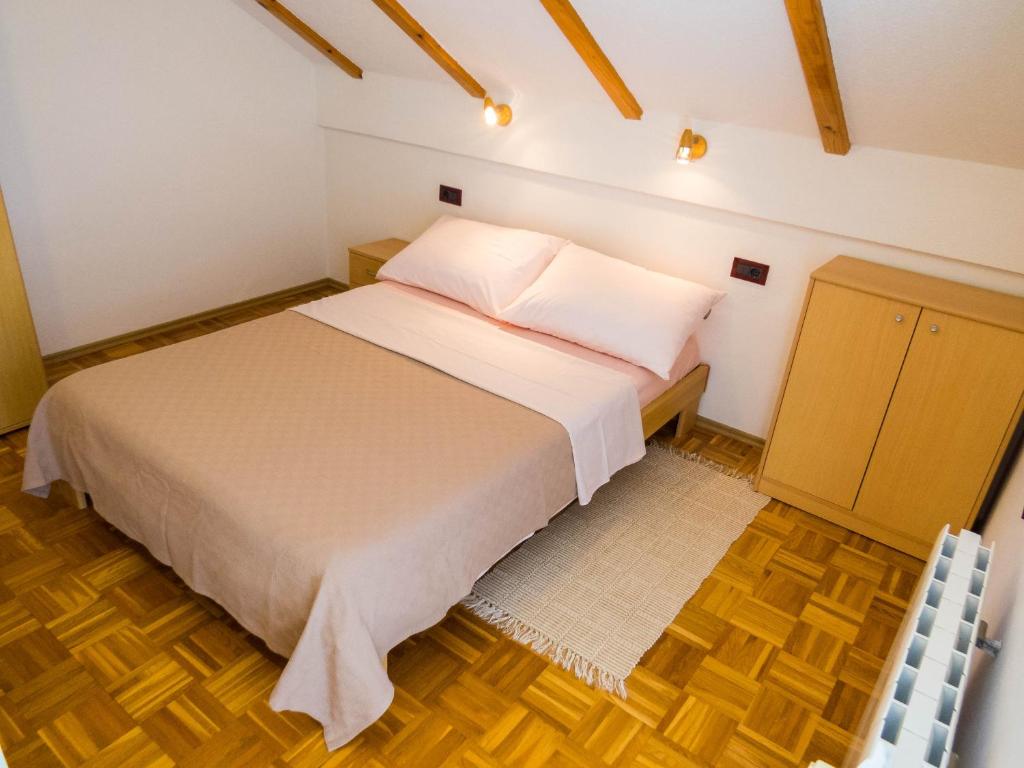 Postel nebo postele na pokoji v ubytování Apartman Miramare