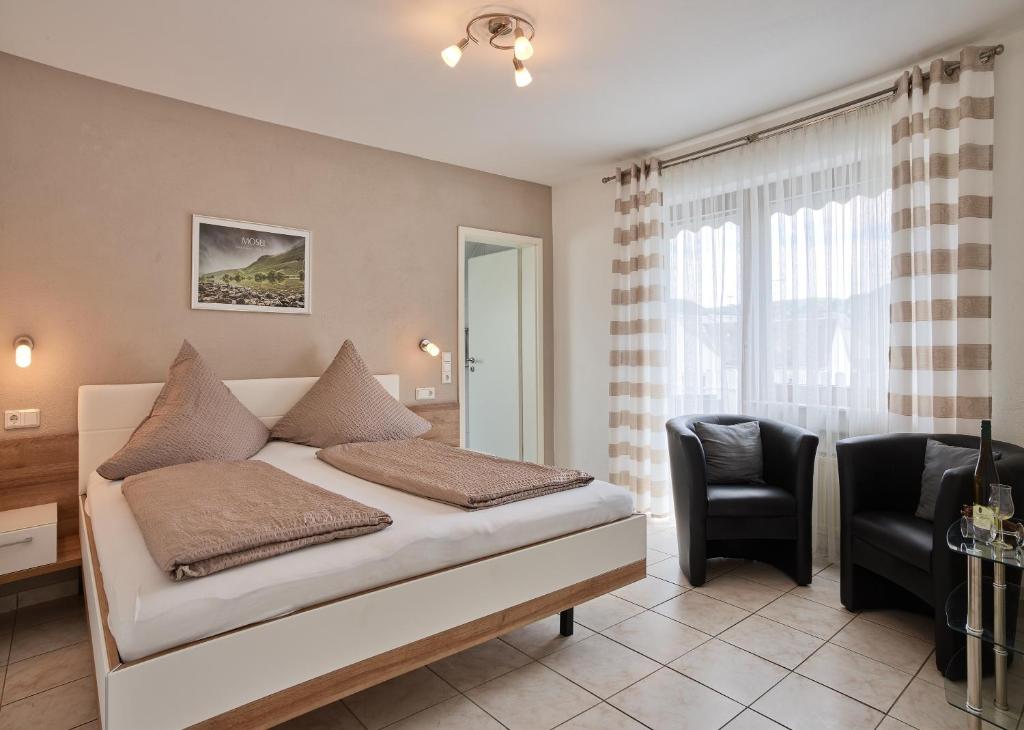 Postel nebo postele na pokoji v ubytování Gästehaus Alexanderhof