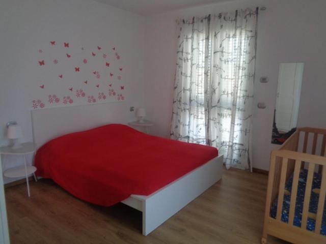 Łóżko lub łóżka w pokoju w obiekcie Casa Luce e Aria