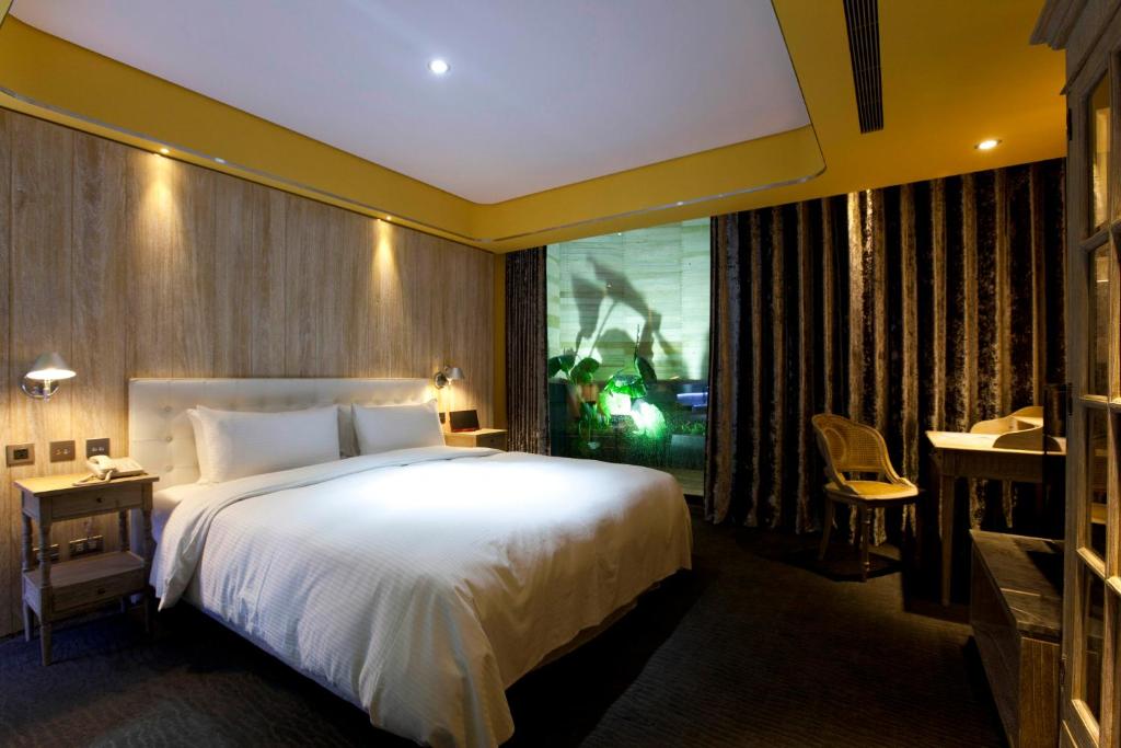 Postel nebo postele na pokoji v ubytování inhouse Hotel