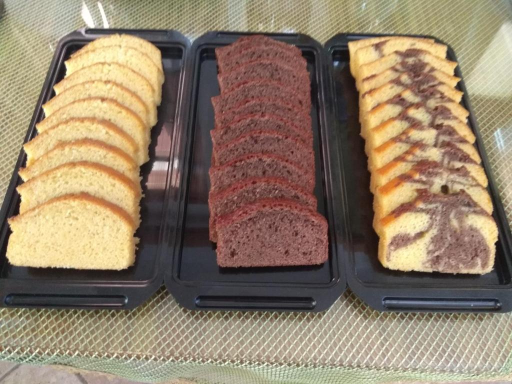three slices of bread in a black plastic container at Dimitris Villa Hotel in Matala