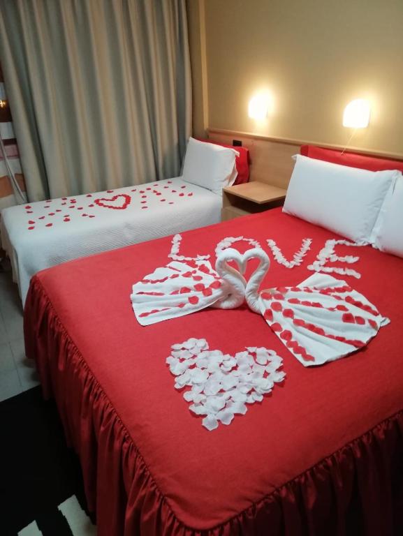 Postel nebo postele na pokoji v ubytování Hotel Nais