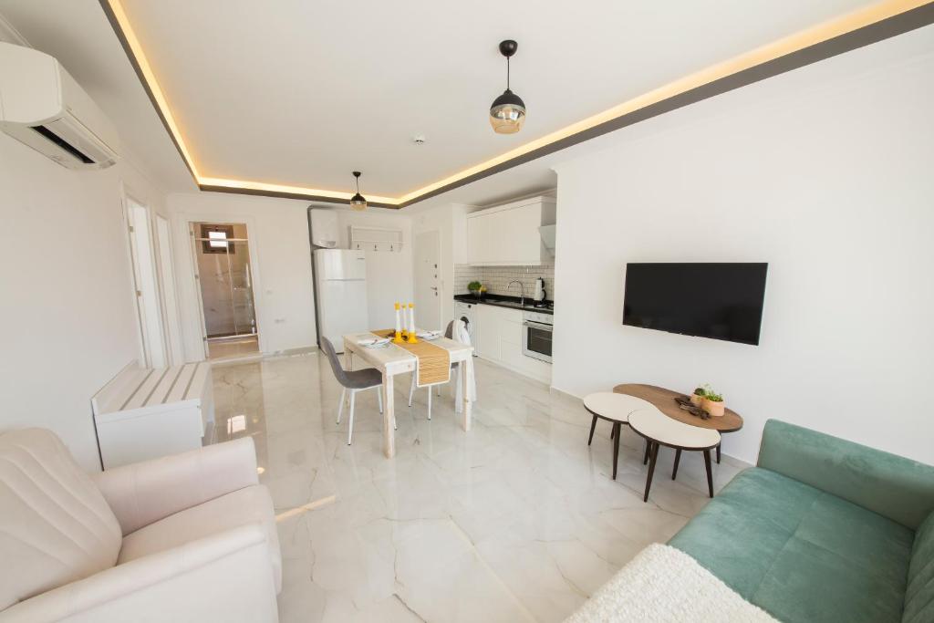 A television and/or entertainment centre at Cedrus Suites
