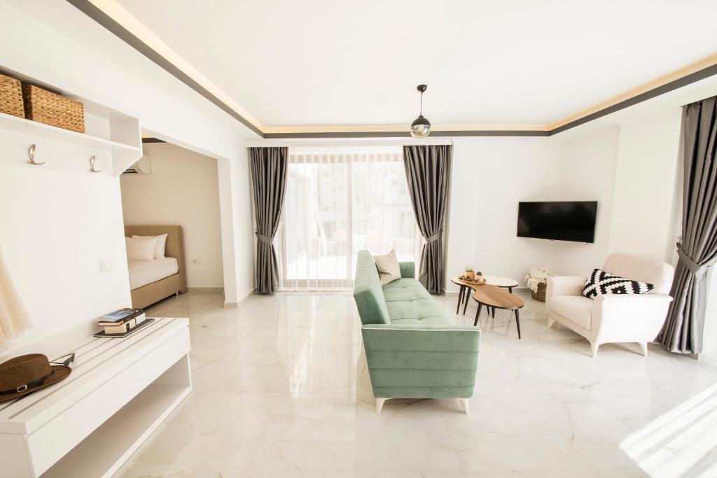 A television and/or entertainment centre at Cedrus Suites