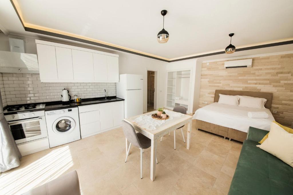 A kitchen or kitchenette at Cedrus Suites