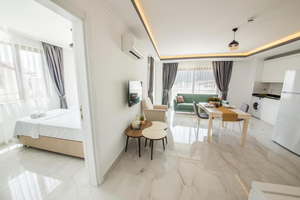 A bed or beds in a room at Cedrus Suites