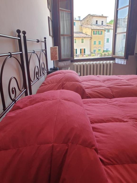 Posteľ alebo postele v izbe v ubytovaní Albergo Giovanni Da Verrazzano