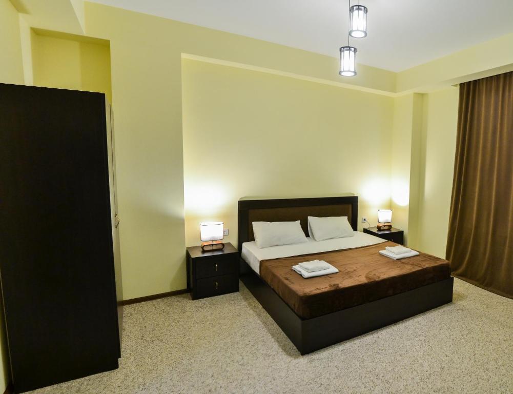 Postel nebo postele na pokoji v ubytování Hotel Garden