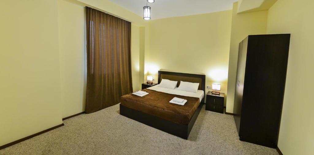 Postel nebo postele na pokoji v ubytování Hotel Garden