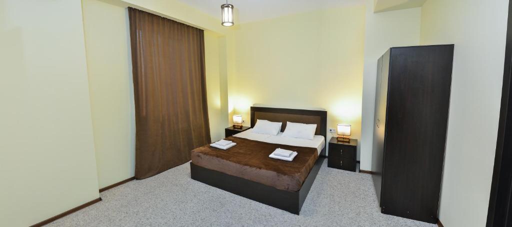 Postel nebo postele na pokoji v ubytování Hotel Garden