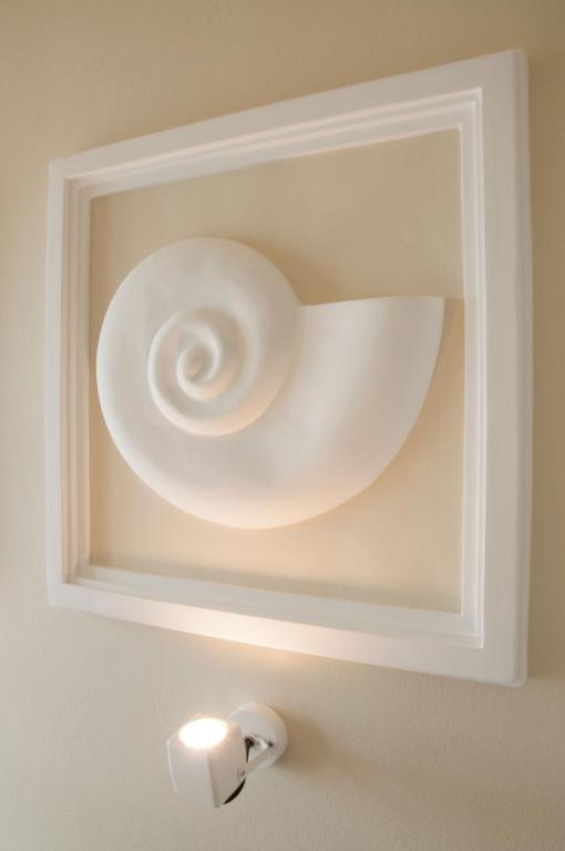 a white bowl in a white box on a wall at Nautilus Nontas Hotel in Megalochori