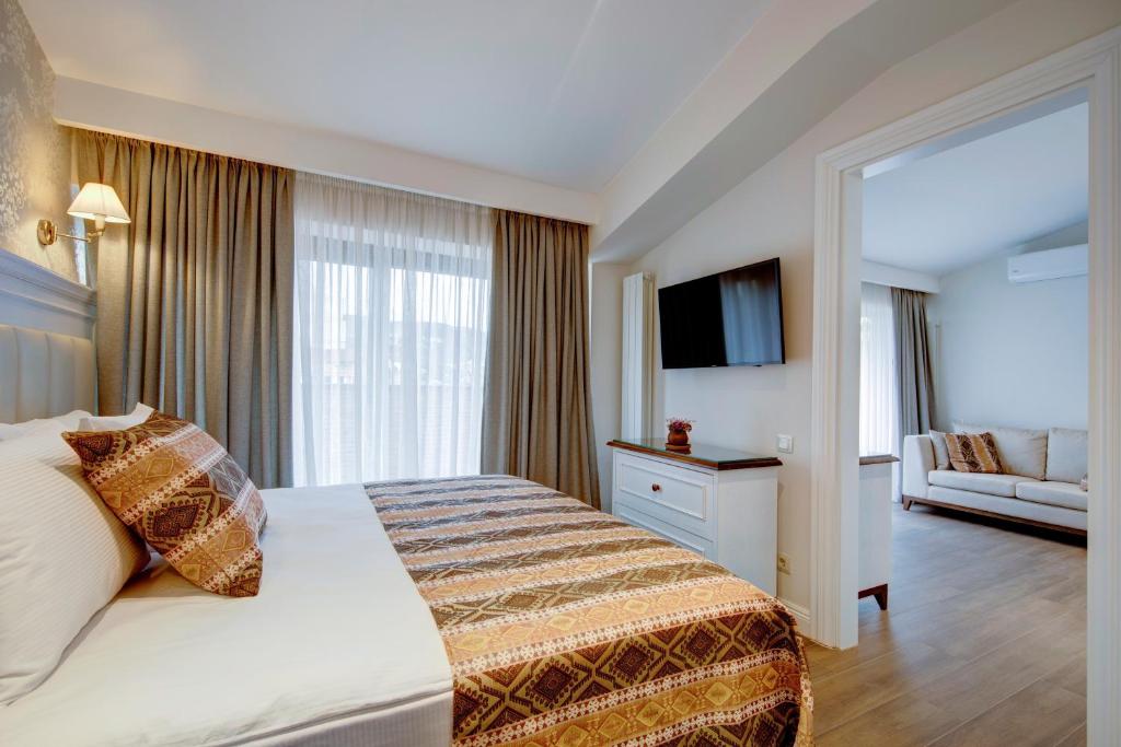 Postel nebo postele na pokoji v ubytování Hotel Passport Tbilisi