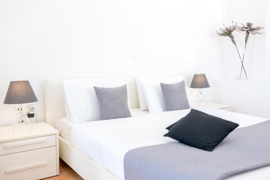 Łóżko lub łóżka w pokoju w obiekcie Dreaming View Suites