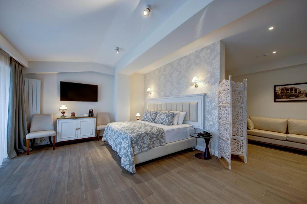 Postel nebo postele na pokoji v ubytování Hotel Passport Tbilisi