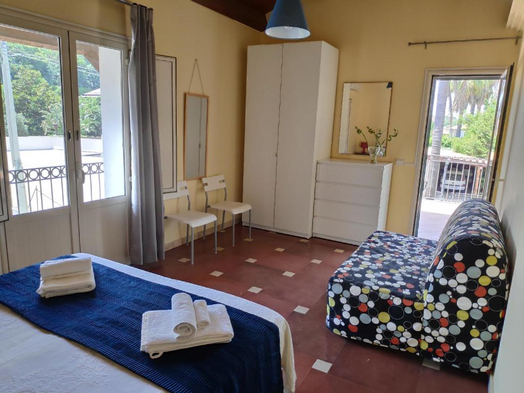 En eller flere senge i et værelse på Villa Linda
