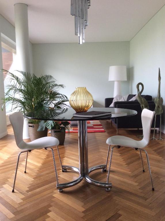 a dining room with a table and two chairs at JULIA LUXURY SUITE in Udine