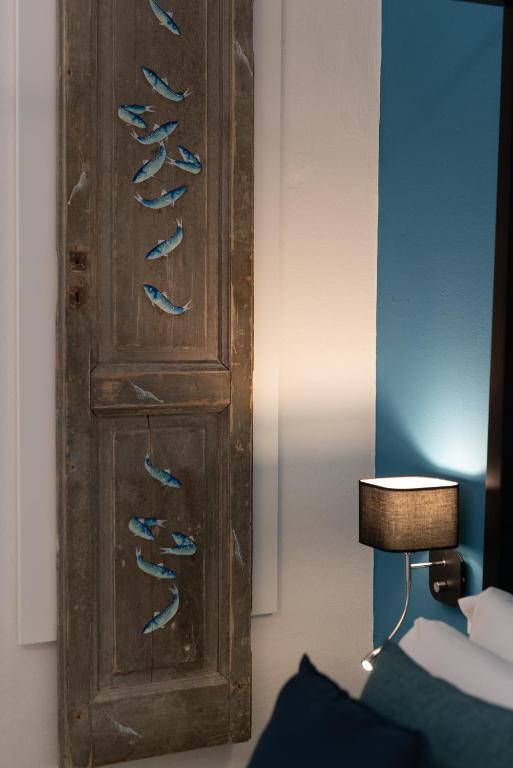 Posteľ alebo postele v izbe v ubytovaní L'EMPORIO ROOMS