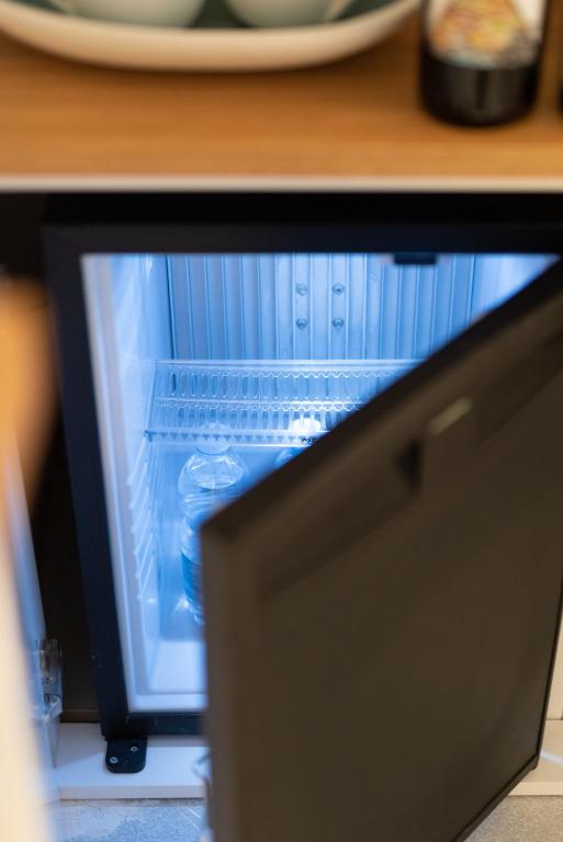 Televízia a/alebo spoločenská miestnosť v ubytovaní L'EMPORIO ROOMS