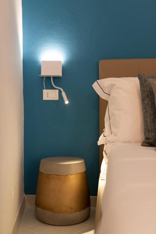 Posteľ alebo postele v izbe v ubytovaní L'EMPORIO ROOMS