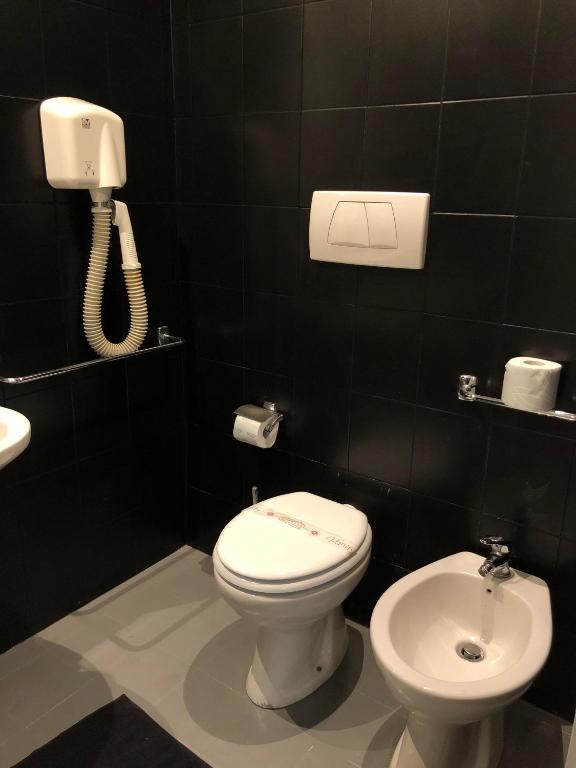 Koupelna v ubytování Hotel Paris