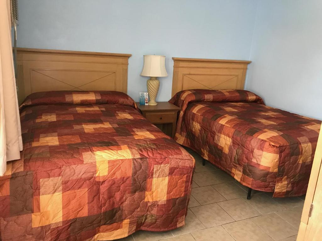 Postel nebo postele na pokoji v ubytování El Ray Motel