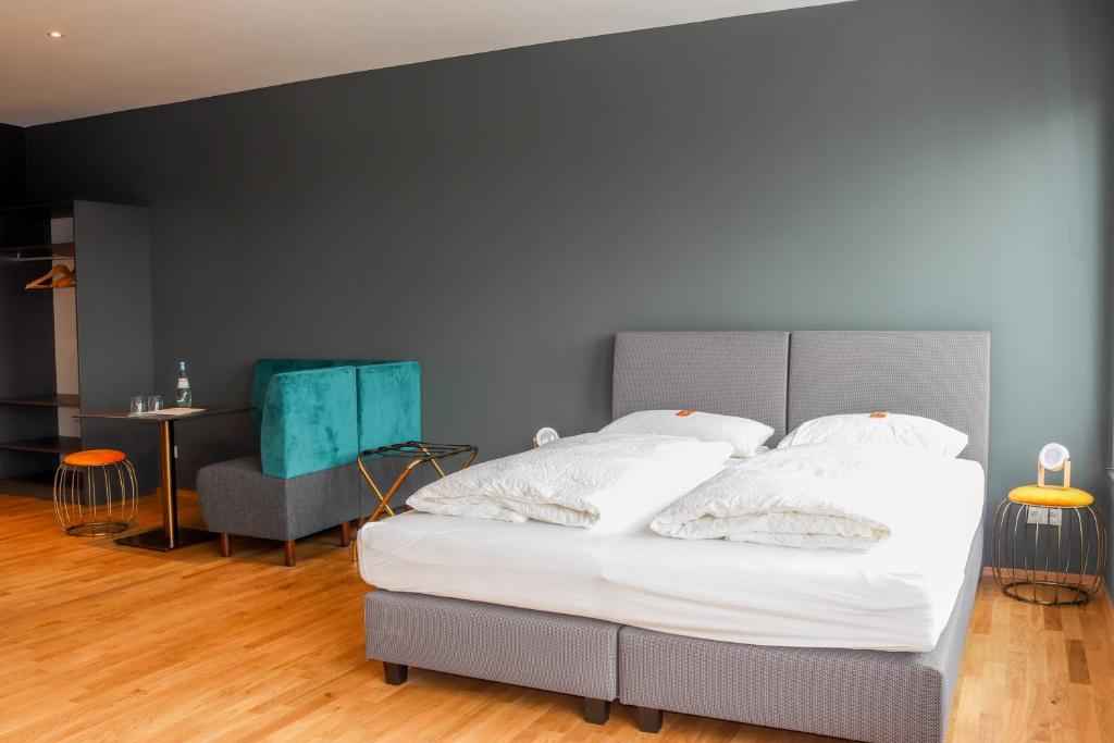 Postel nebo postele na pokoji v ubytování Das Fischer Boardinghouse BW