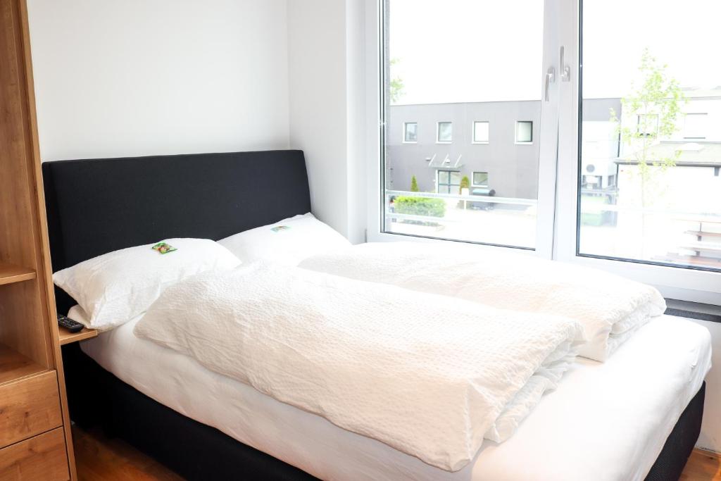 Postel nebo postele na pokoji v ubytování Das Fischer Boardinghouse BW