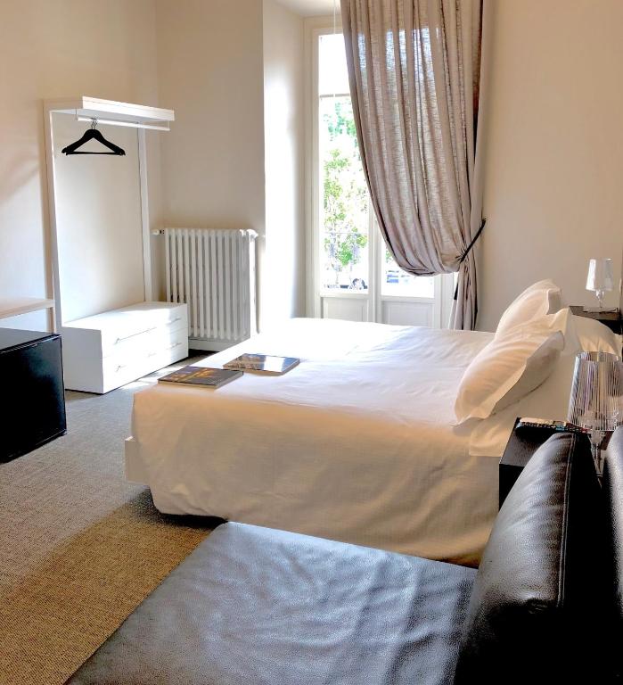 Postel nebo postele na pokoji v ubytování Bue Nero Suites Verona