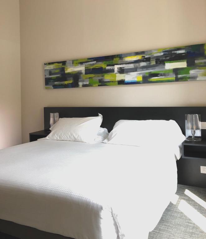 Postel nebo postele na pokoji v ubytování Bue Nero Suites Verona