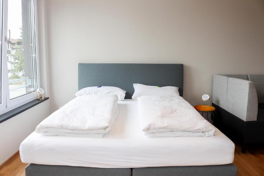Postel nebo postele na pokoji v ubytování Das Fischer Boardinghouse BW