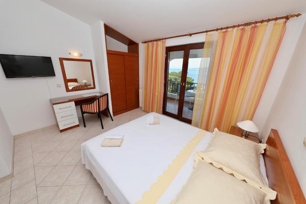 Rúm í herbergi á Ribičić Guesthouse