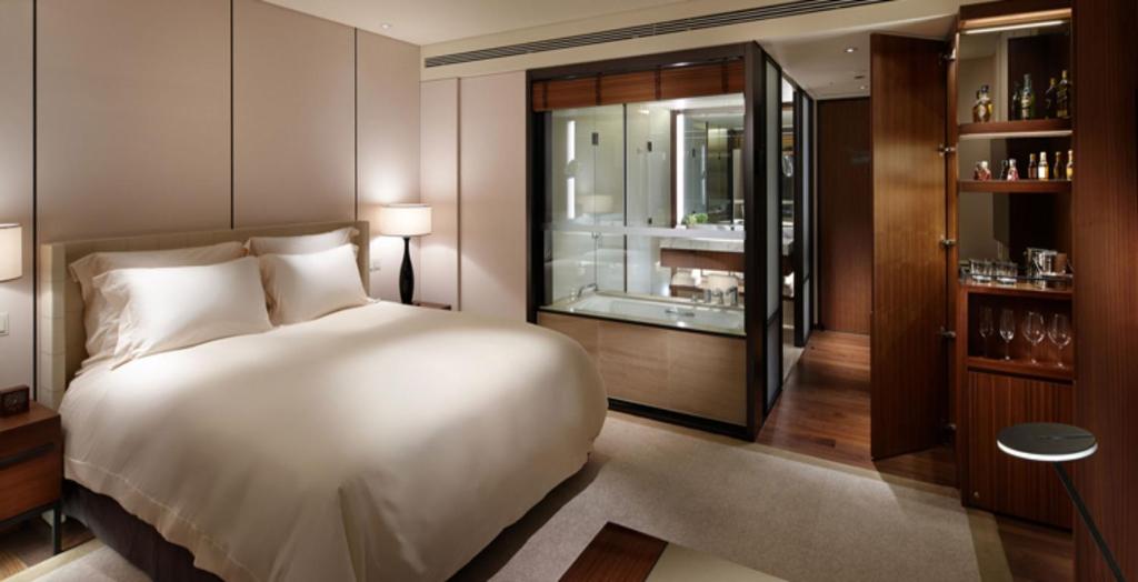 a bedroom with a large white bed and a window at The Shilla Seoul in Seoul
