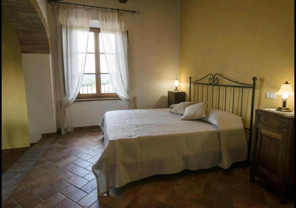 Postel nebo postele na pokoji v ubytování Casetta della Pina