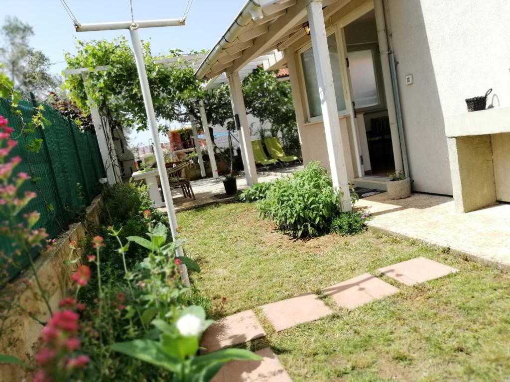 a garden in the backyard of a house at Apartment Lucija in Rovinj