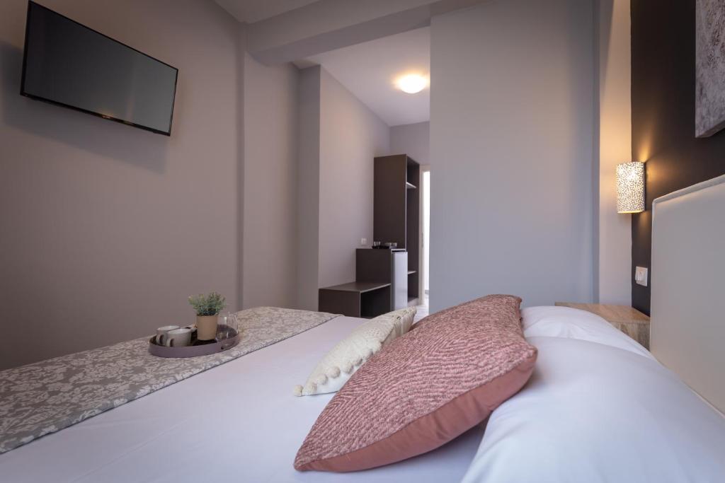 Postel nebo postele na pokoji v ubytování Ionian City