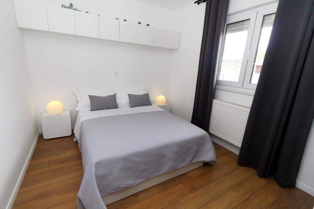 Postel nebo postele na pokoji v ubytování Apartments Pivac