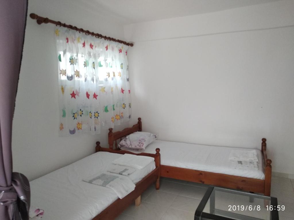 Postel nebo postele na pokoji v ubytování Casa Prifti
